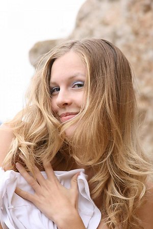 Small-breasted amateur taking off her white clothes and posing nude