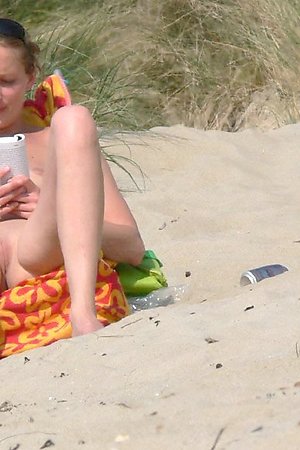 Teenage nudists naked on beach