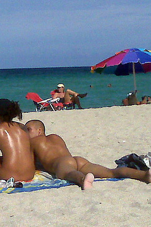 Nude females an males on the nudist beach