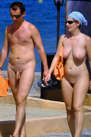 Amateur nudists and theirs beach body painting