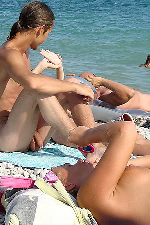 Lovely girls bare their bodies on the beach