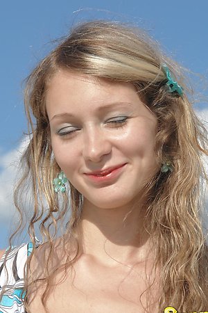Smiling amateur hottie showing off her sweet pussy on the beach