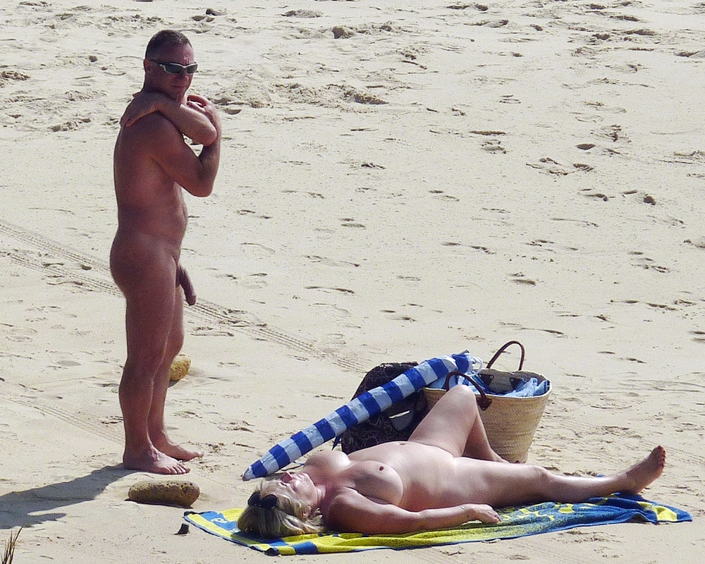 Real girls, men posing nude at the public beach.